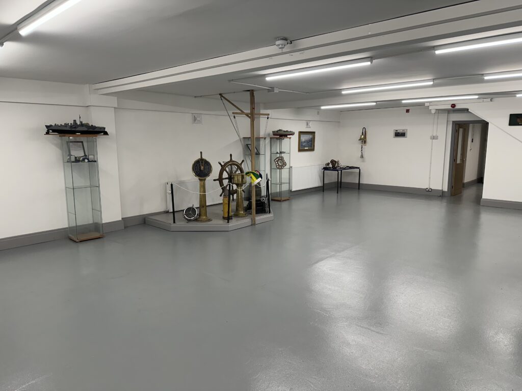 Refurbished Ashington Sea Cadets room with nautical display and grey floor